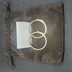 NWOT Michael Kors buckle white gold tone hoop earrings. Fabulous Summer Fashion!